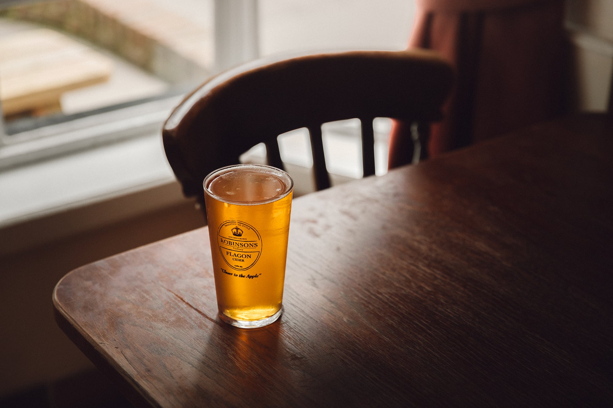 A cold pint of Robinsons Flagon Cider on the table in a traditional Herefordshire pub